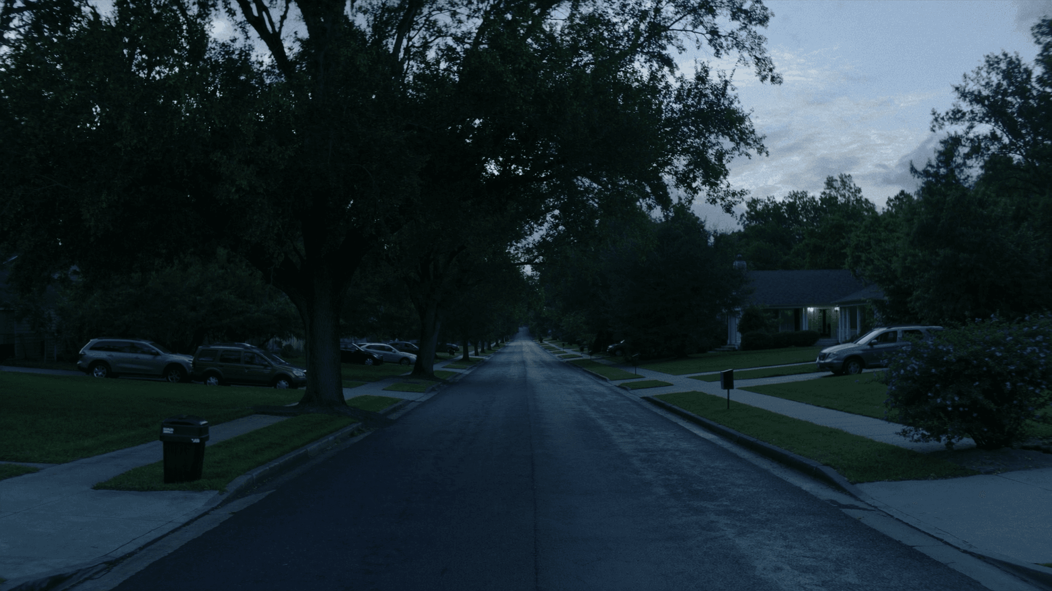 A residential street at dusk, the kind of block investors farm for their next deal.